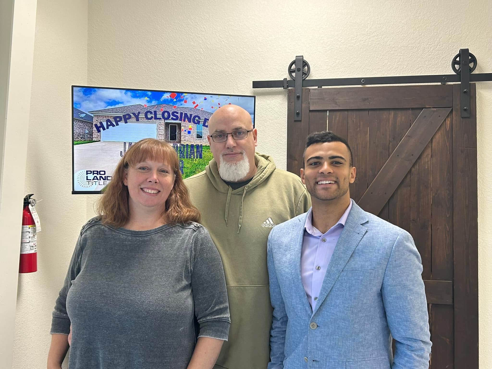 Madison Burke with clients after closing day