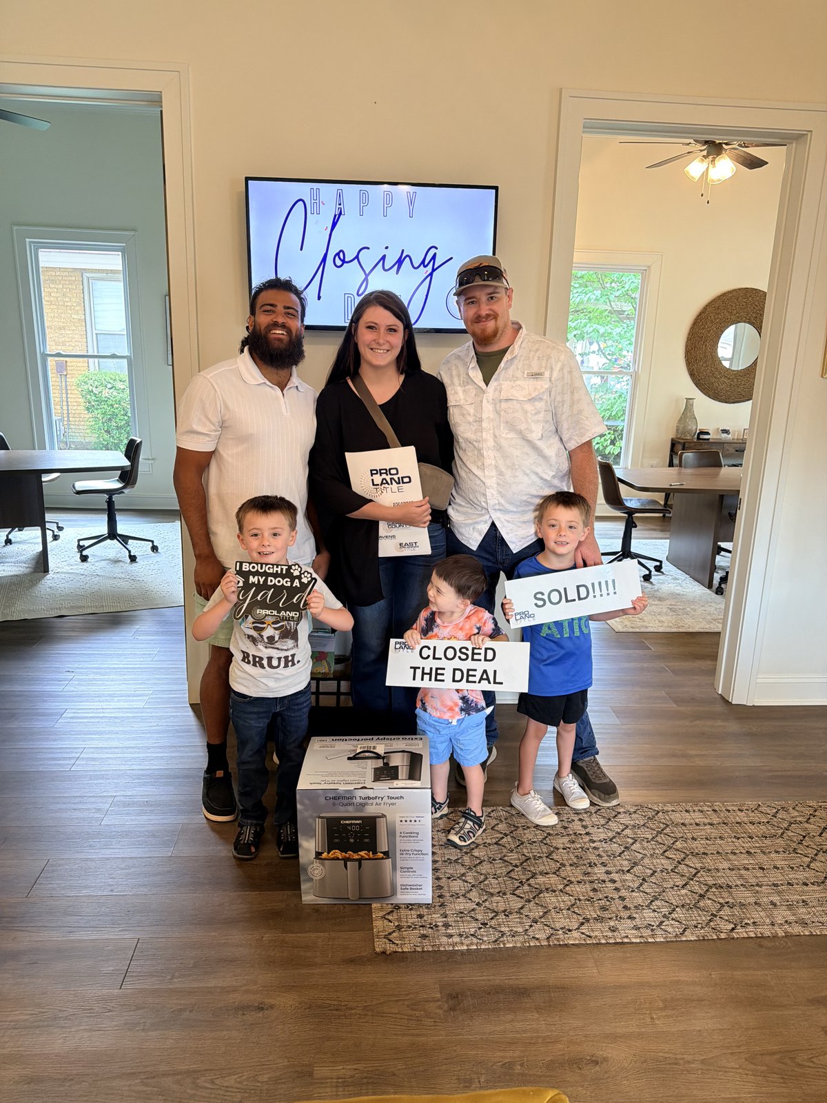 Madison Burke celebrating closing day with clients and family