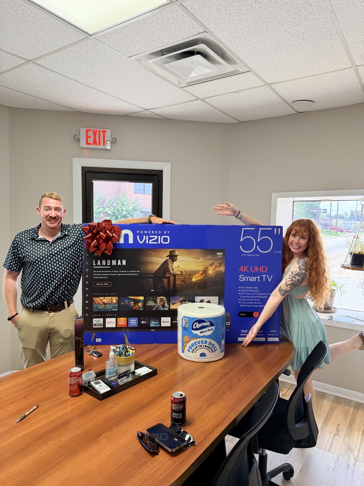 Happy clients with a closing gift from Madison Burke